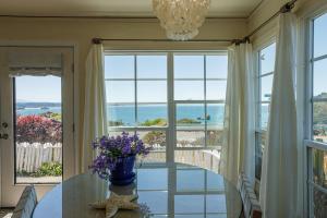 a dining room with a view of the ocean at Lookout At Trinidad Bay in Trinidad