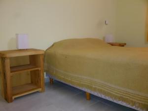 Una cama o camas en una habitación de Valle de Epuyen