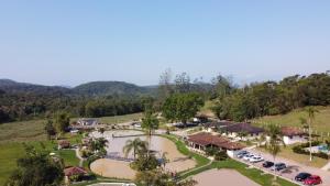 an aerial view of a resort with a flooded parking lot at Recanto da Mata Morretes in Morretes