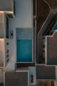 an overhead view of a swimming pool in a building at Alon Sevou Boutique Hotel in Sivota
