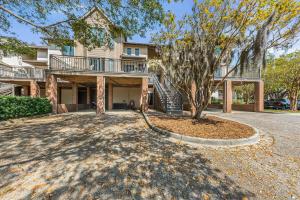 an empty driveway in front of a house at 1935 Bohicket Marina in Seabrook Island