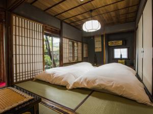 Voodi või voodid majutusasutuse Temple Hotel Takayama Zenkoji toas