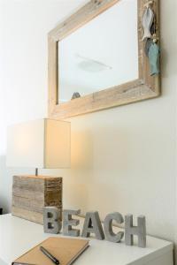 a mirror on top of a desk with a desk at Marina Loft in Kappeln