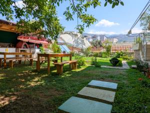 a park with a picnic table and a roller coaster at Villa Vasil Mertiri in Himare +24 photos