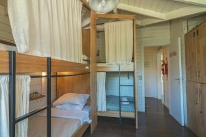 Postel nebo postele na pokoji v ubytování INDÓMITO HOSTEL