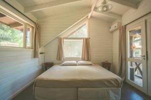 Postel nebo postele na pokoji v ubytování INDÓMITO HOSTEL