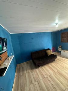 TV a/nebo společenská místnost v ubytování Casa Pé na Lagoa - Pôr do Sol Incrível e Conforto em Figueira