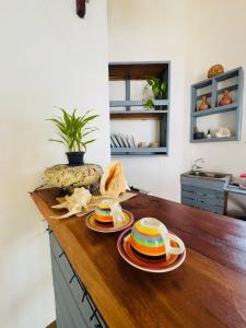 a counter with plates and bread on top of it at The Village Tangalle in Tangalle