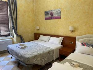 Postel nebo postele na pokoji v ubytování Rainbow Guest House