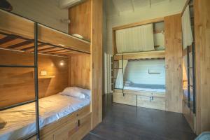 Postel nebo postele na pokoji v ubytování INDÓMITO HOSTEL