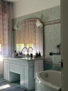 a bathroom with a sink and a bath tub at Guest House Sant'Antonio  +40 photos