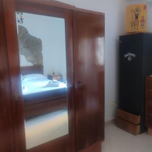 a sliding glass door leading to a bedroom with a bed at Casa Camella in Perdifumo