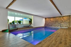 a swimming pool in the middle of a house at LuCA Hotel in Bodenmais