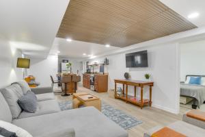 a living room with a couch and a bed at Logan Square Urban Oasis: 2 Mi to Local Hotspots! in Chicago