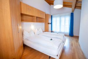Postel nebo postele na pokoji v ubytování Chalet Wassermandli