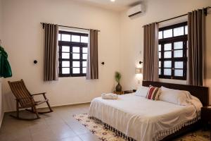 Ένα ή περισσότερα κρεβάτια σε δωμάτιο στο Casa Grande 5 Blocks To Montejo +31 φωτογραφίες