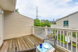 a wooden deck with a table and chairs on it at about 1 Block to Bethany Beach, Retreat with Pool Access in Bethany Beach