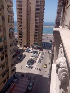 an aerial view of a city street with buildings at sidi bashr el tram street ali abi bash in Banī Ghālib