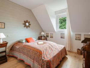 a bedroom with a bed and a window at Holiday Home Le Nyce by Interhome in Lancieux