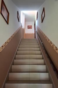 a staircase in a building with art on the walls at Apartment Pajtas 1 by Interhome in Balatonfenyves