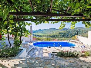 a pool in a villa with a view at Holiday Home Prusina by Interhome in Smokvica