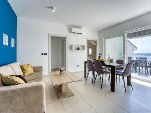 a living room with a couch and a table at Apartment Dita-5 by Interhome in Crikvenica