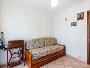 a couch in a corner of a room with a table at Holiday Home Ca'de Pauline by Interhome in Gazzelli