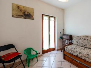 a living room with a couch and a chair at Holiday Home Ca'de Pauline by Interhome in Gazzelli