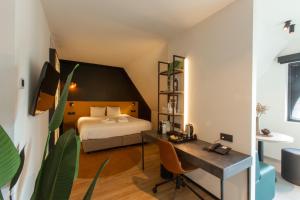Krevet ili kreveti u jedinici u okviru objekta Ariane Hotel