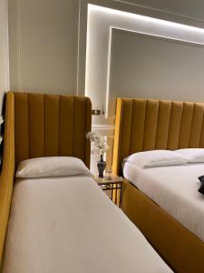 Postel nebo postele na pokoji v ubytování Unicum Trastevere Suites