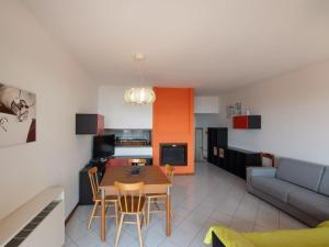 a kitchen and living room with a table and chairs at Apartment Norby by Interhome in Ghiffa +22 photos