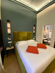 Postel nebo postele na pokoji v ubytování Unicum Trastevere Suites