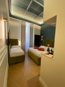 Postel nebo postele na pokoji v ubytování Unicum Trastevere Suites