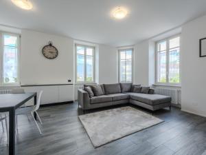 a living room with a couch and a table at Apartment Leoni by Interhome in Rovereto