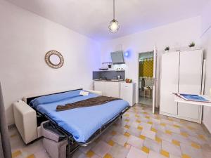 a hospital room with a bed and a tv at Apartment Mono 0-8-N Marineledda by Interhome in Golfo Aranci