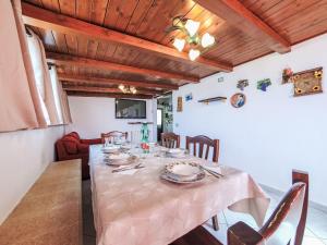 a dining room with a table and chairs at Apartment Casa sugli Uliveti by Interhome in Paceco