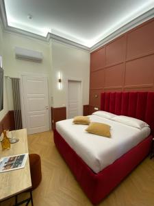 Postel nebo postele na pokoji v ubytování Unicum Trastevere Suites