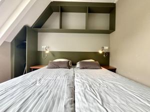 En eller flere senge i et værelse på Apartment Boszicht Group by Interhome