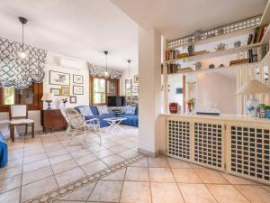 a living room with a couch and a table at Villa Villa Al Mare by Interhome in Su Forti