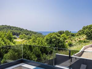a balcony with a view of the ocean at Villa Delecto by Interhome in Pula