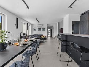 a kitchen and living room with a table and chairs at Villa Delecto by Interhome in Pula +44 photos