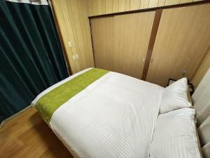 Letto o letti in una camera di Villa FUNABASHI
