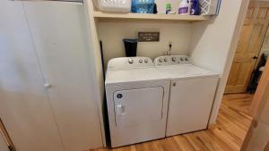 a small white washer and dryer in a room at Hickory Ridge - HotTub - GSMNP, NOC, Train and Fontana Lake in Almond +19 photos