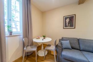 a living room with a couch and a table at Al Torrione in Collecchio