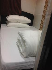 Katil atau katil-katil dalam bilik di Manhattan Guesthouse