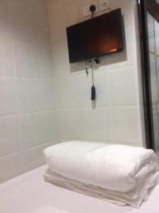 Katil atau katil-katil dalam bilik di Manhattan Guesthouse
