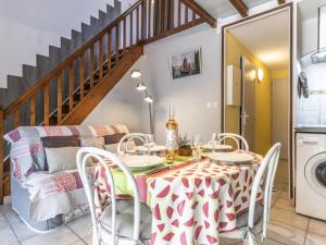 a kitchen and dining room with a table and chairs at Holiday Home Hacienda Beach II-7 by Interhome in Agde