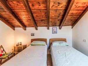 Ένα ή περισσότερα κρεβάτια σε δωμάτιο στο Apartment Laghina by Interhome