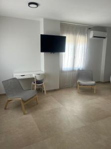TV a/nebo společenská místnost v ubytování Los Cipreses