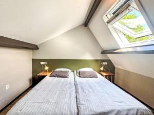 En eller flere senge i et værelse på Apartment Boszicht 6 by Interhome